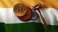 court gavel and bitcoin laying on India flag