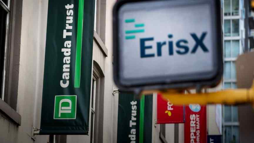 ErisX logo and name on white billboard in front of Canada Trust building