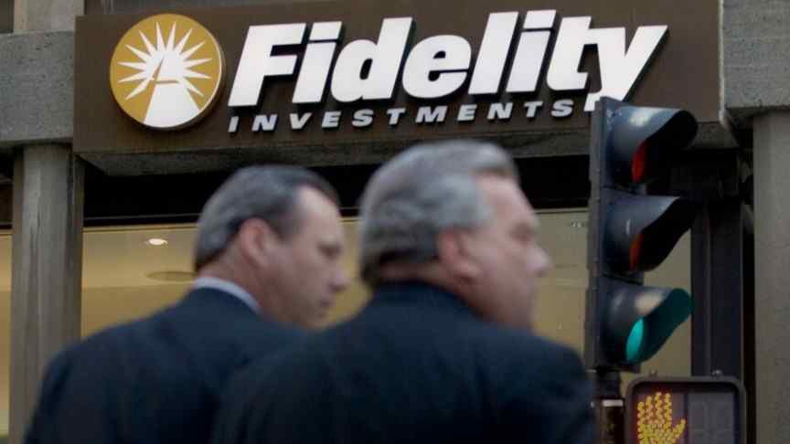 two man standing in front of fidelity building entrance