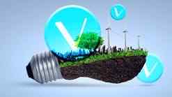 VeChain logo on light bulb filled with grass and wind mills
