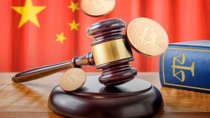 court gavel, bitcoins and book on wooden table, china's flag