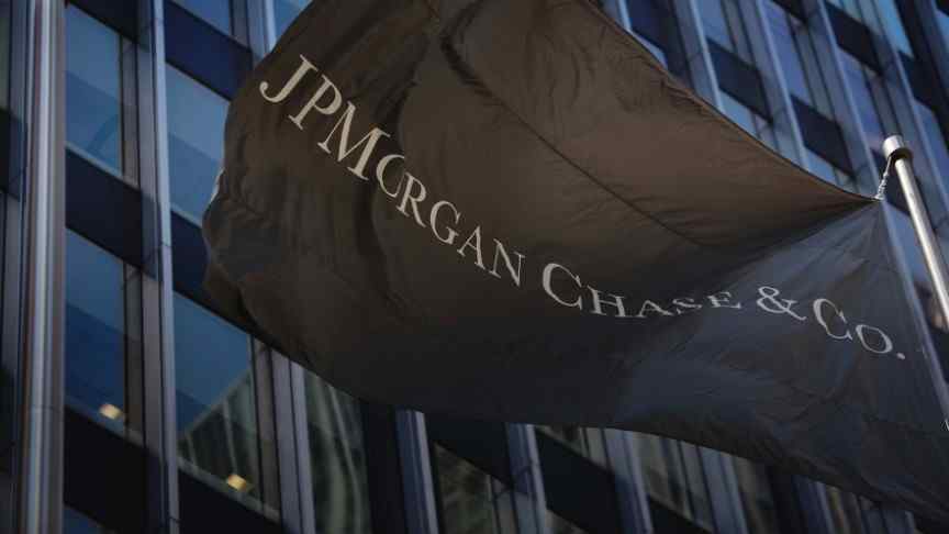 JPM flag waving in front of building