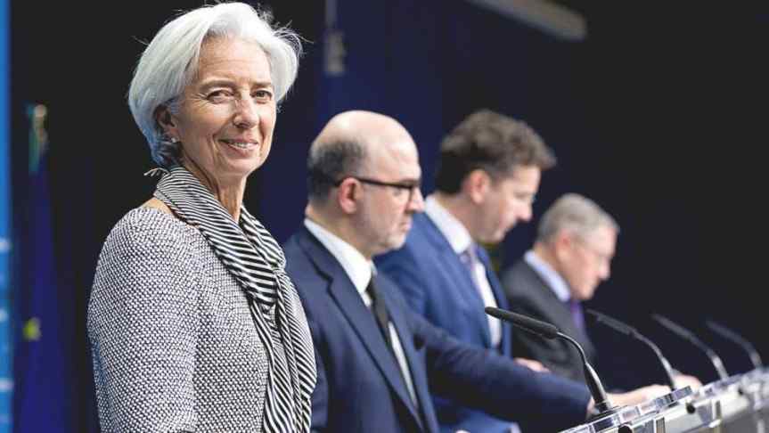 Image of Christine Lagarde and three suited men