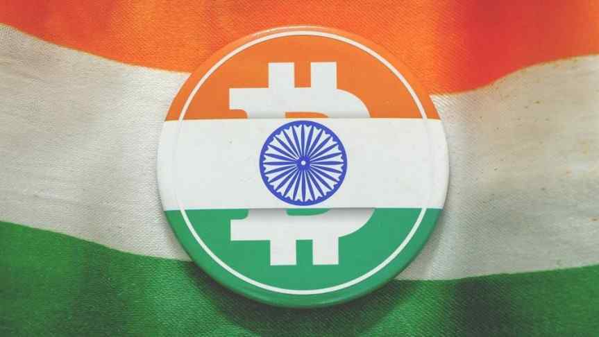 Bitcoin logo in the colours of India's flag and the indian flag as a background