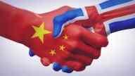 Shaking Hands covered in China and Iceland flags