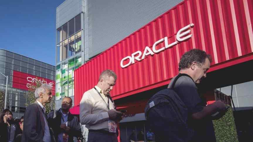 People in front of an Oracle building