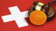 Illustration of a gavel and a coin over the Swiss flag