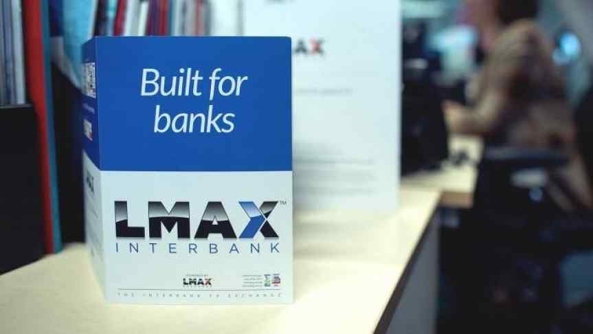 Office room image with a closeup on a flyer saying ‘LMAX - Built for banks’