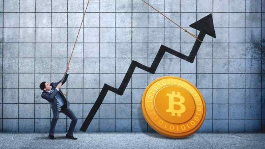 Man pulling a chart using a rope and a Bitcoin supported by the wall