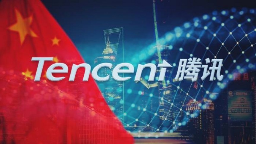 Tencent English and Chinese name on background of red flag with stars, blurry net and skyscrapers