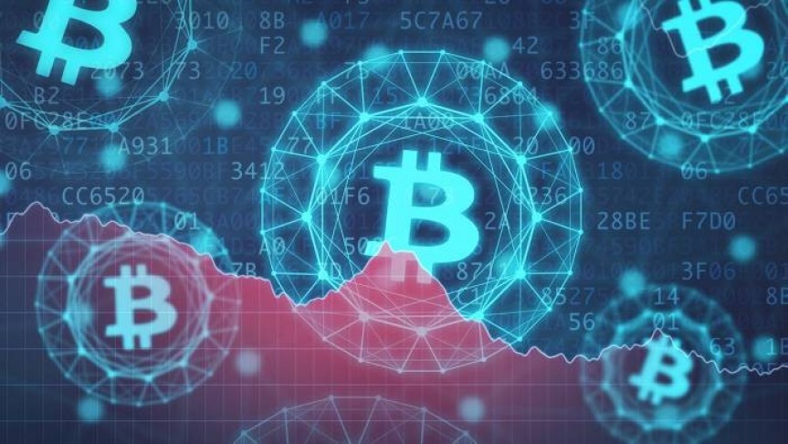 5 Bitcoin logos in bright blue floating on background of red graph and numbers