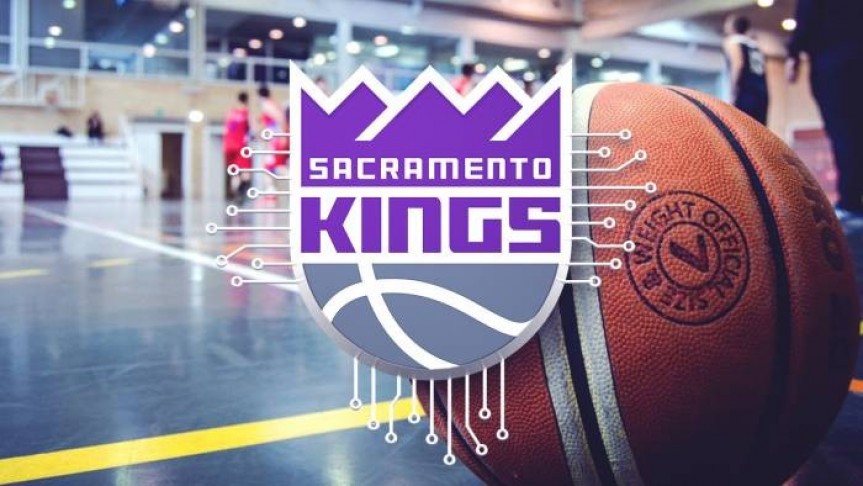 Sacramento Kings logo in grey, purple and white. Image of basketball on basketballcourt