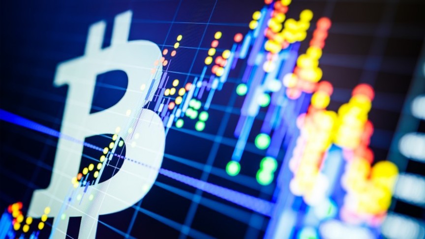 Bitcoin logo on background of luminous, colorful graph