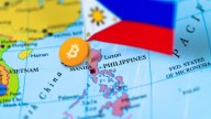 A map of the world, Philippines flag and Bitcoin marking the country's location
