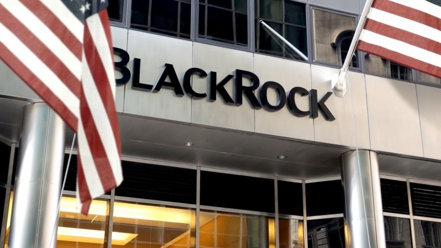 BlackRock building entrance, US flags on the right and left