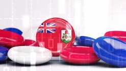 blue, red and white disks, one with UK and Bermuda flags