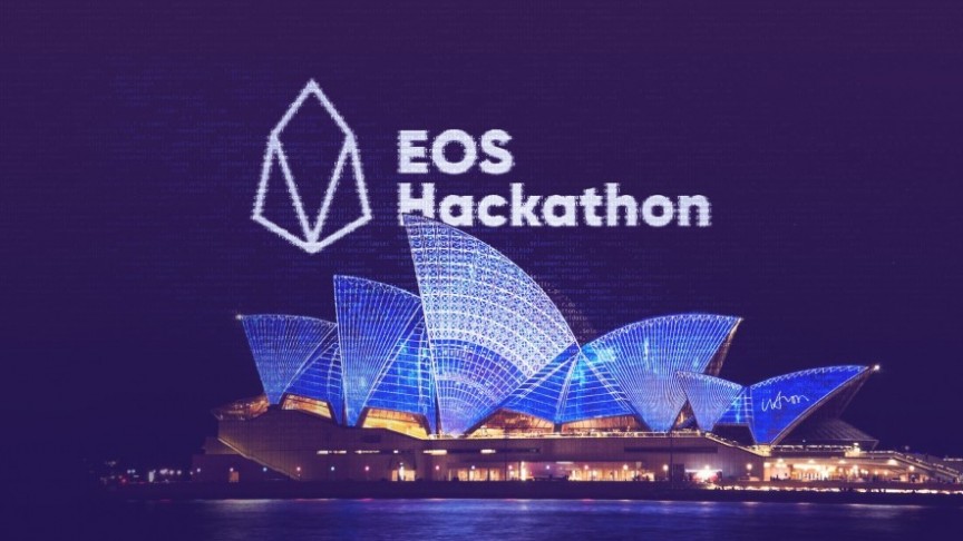 EOS Hackathon and EOS logo in white on background of lit Sydney Opera House at night