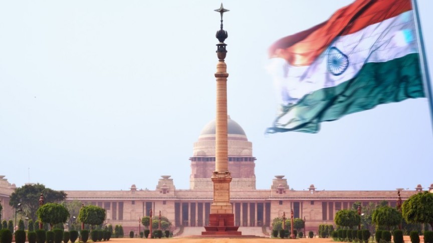 -Indian flag waving in front of Indian government building