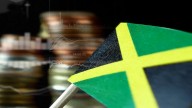 -Jamaican flag, blurry stacks of coins